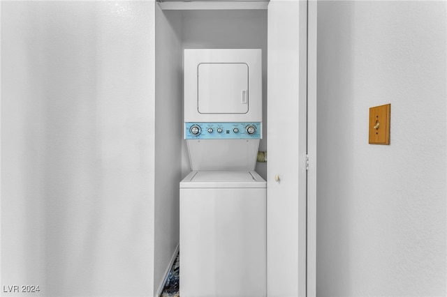 laundry room featuring stacked washer and clothes dryer