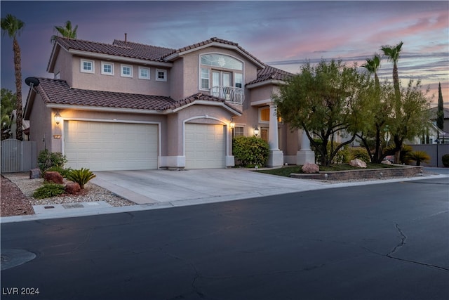 mediterranean / spanish-style home featuring a garage