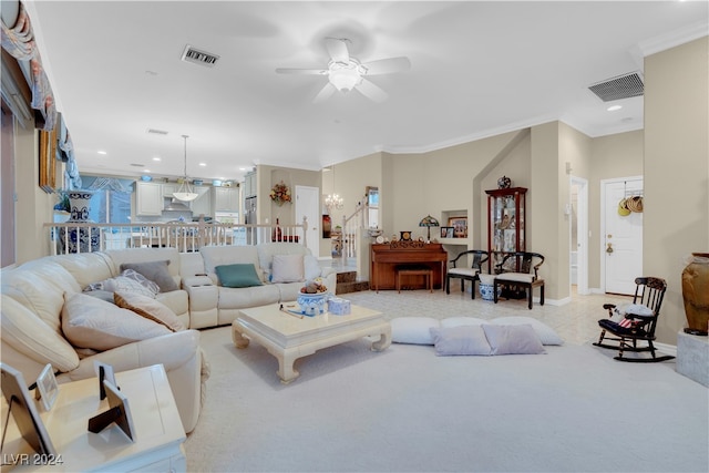 carpeted living room featuring ornamental molding and ceiling fan