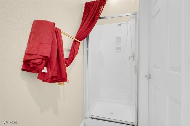 bathroom featuring an enclosed shower