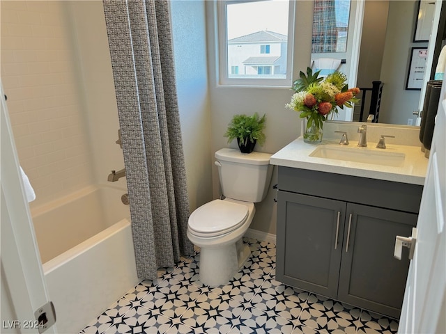 full bathroom with vanity, shower / bath combo with shower curtain, toilet, and tile patterned floors