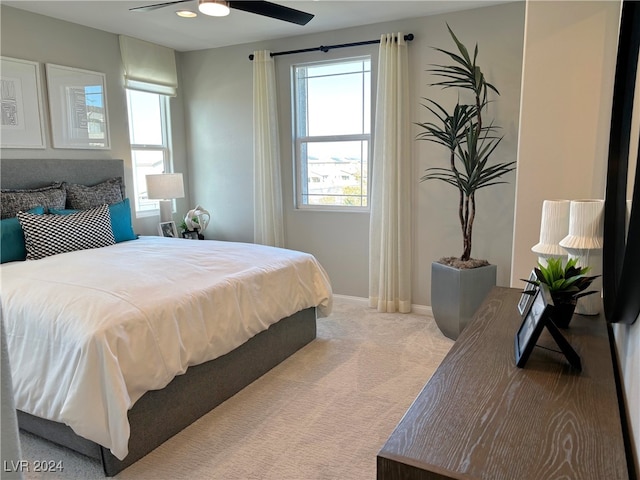 carpeted bedroom featuring ceiling fan