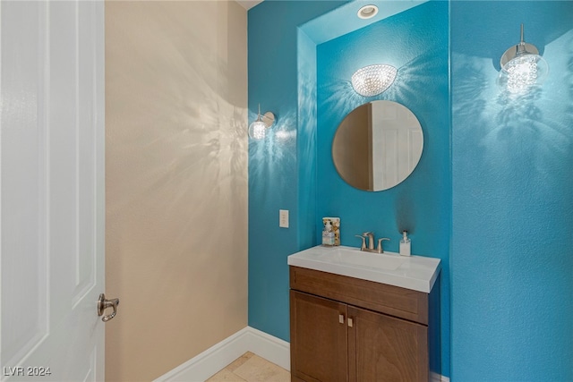 bathroom featuring tile patterned flooring and vanity