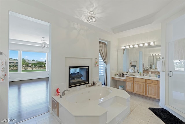 bathroom with vanity, plus walk in shower, a chandelier, and hardwood / wood-style flooring