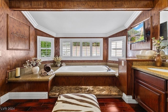 bathroom with wood-type flooring, ornamental molding, vaulted ceiling, and vanity