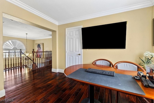 dining space with hardwood / wood-style flooring, an inviting chandelier, and ornamental molding