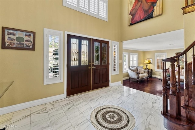 entryway featuring ornamental molding