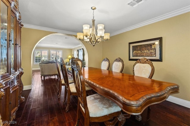 dining room featuring ornamental molding, a chandelier, and dark hardwood / wood-style flooring