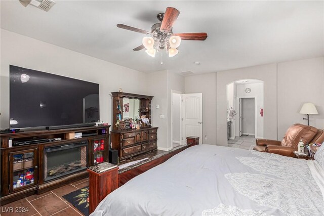 bedroom featuring ceiling fan and tile patterned floors