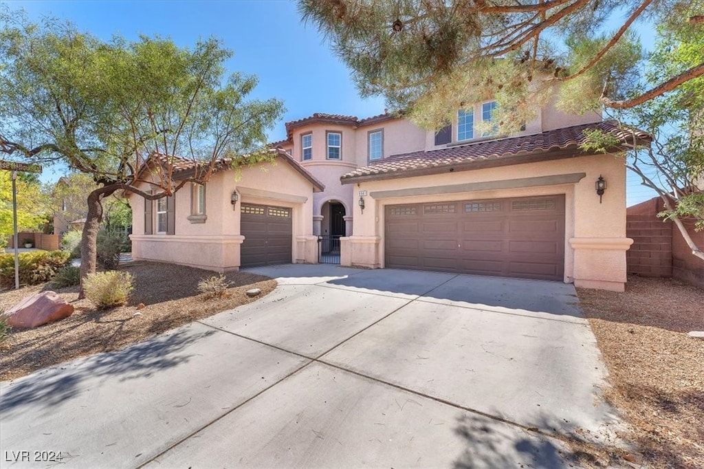 mediterranean / spanish-style house featuring a garage