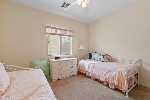 bedroom featuring ceiling fan and light carpet