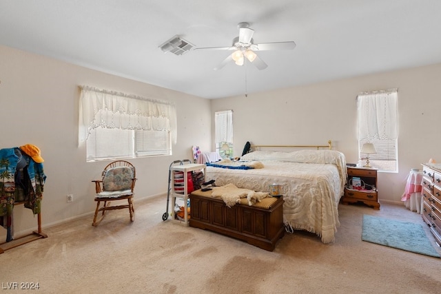 bedroom with light colored carpet and ceiling fan