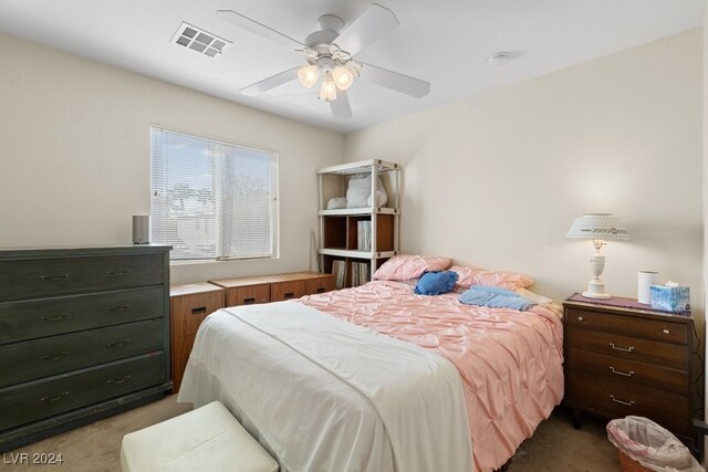 bedroom featuring ceiling fan and light colored carpet