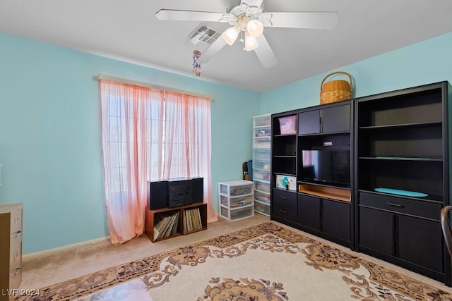 living room featuring ceiling fan and light colored carpet