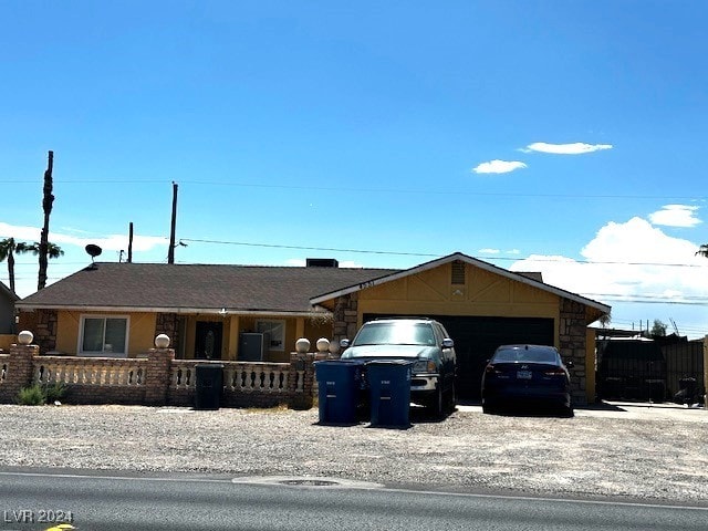 ranch-style home featuring a garage