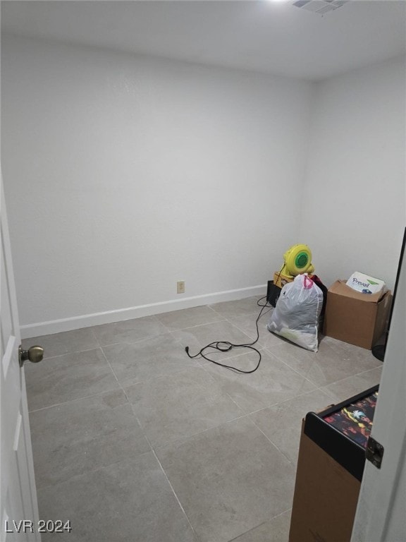 interior space with light tile patterned floors