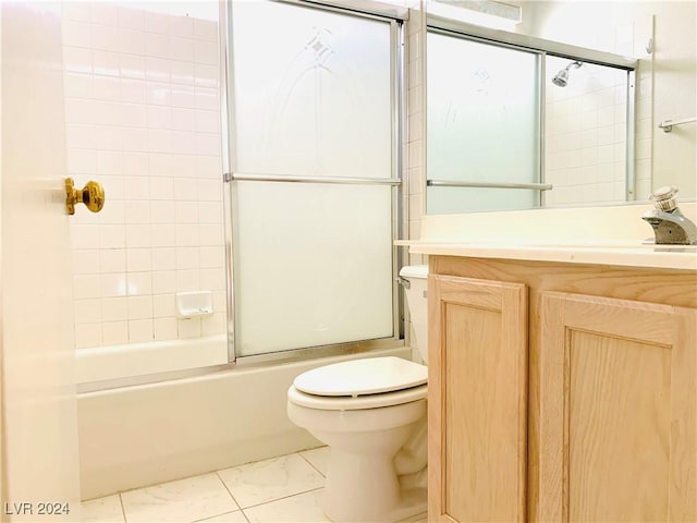 full bath featuring marble finish floor, toilet, bath / shower combo with glass door, and vanity