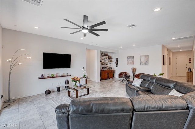 tiled living room with ceiling fan