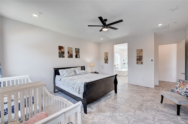 bedroom featuring ceiling fan and ensuite bath