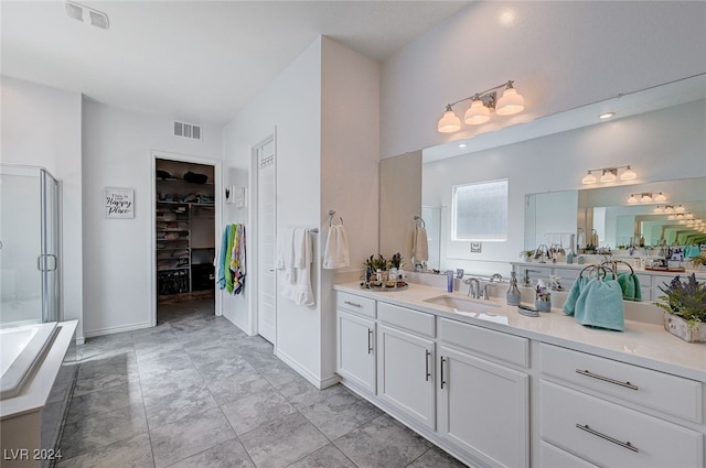 bathroom featuring walk in shower and vanity