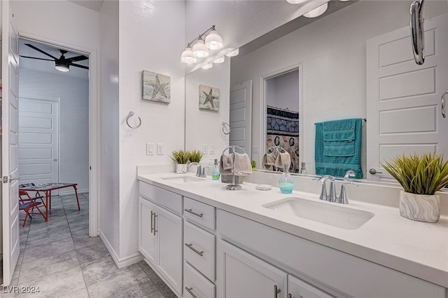 bathroom featuring tile patterned flooring, ceiling fan, and vanity