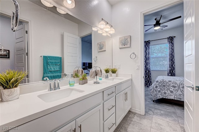 bathroom featuring tile patterned floors, ceiling fan, and vanity