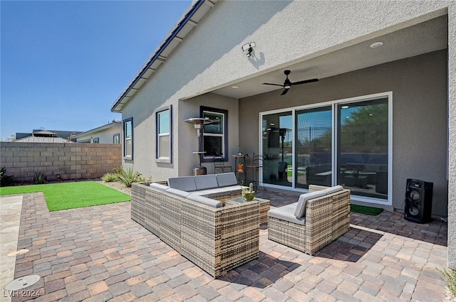 view of patio / terrace with an outdoor living space and ceiling fan