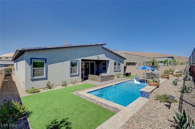 view of pool featuring a yard and a patio area