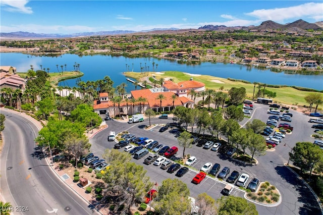 aerial view featuring a water and mountain view