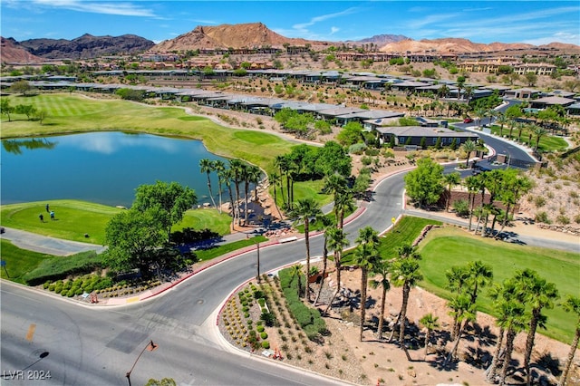 drone / aerial view featuring a water and mountain view