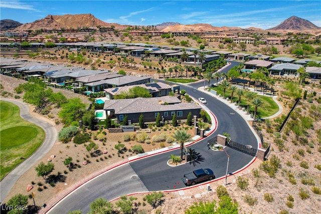 birds eye view of property with a mountain view