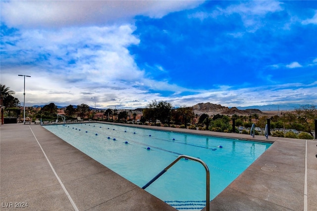 view of pool with a mountain view