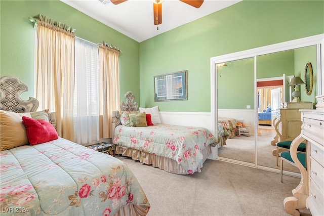 bedroom featuring light colored carpet and ceiling fan