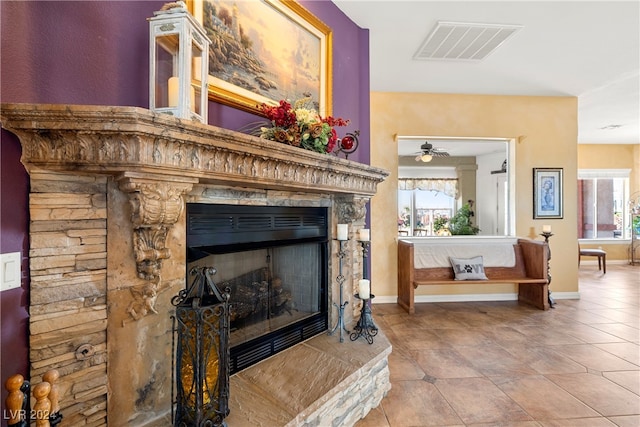 interior details with a stone fireplace