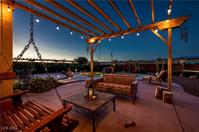 patio terrace at dusk with a fenced in pool, a pergola, and an outdoor hangout area