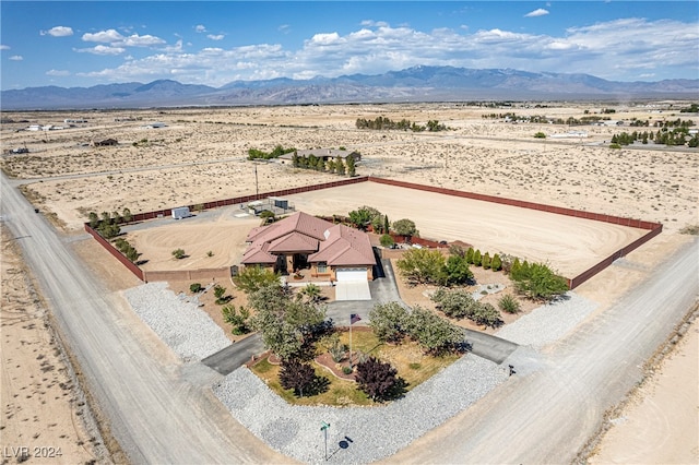 birds eye view of property with a mountain view