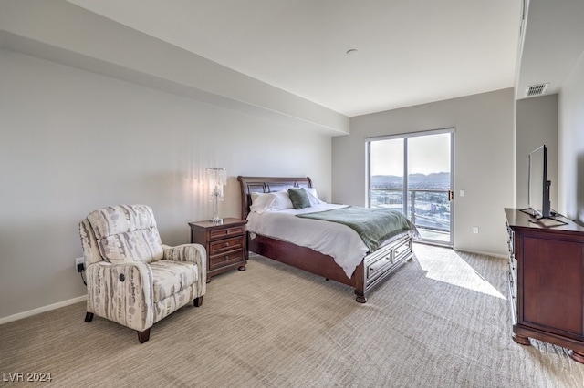 bedroom featuring light carpet, access to outside, visible vents, and baseboards