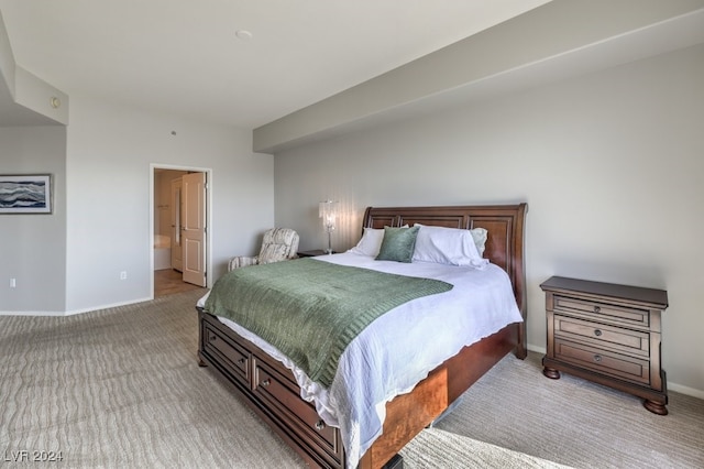 bedroom featuring light colored carpet and baseboards