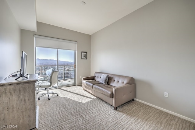 carpeted office featuring baseboards