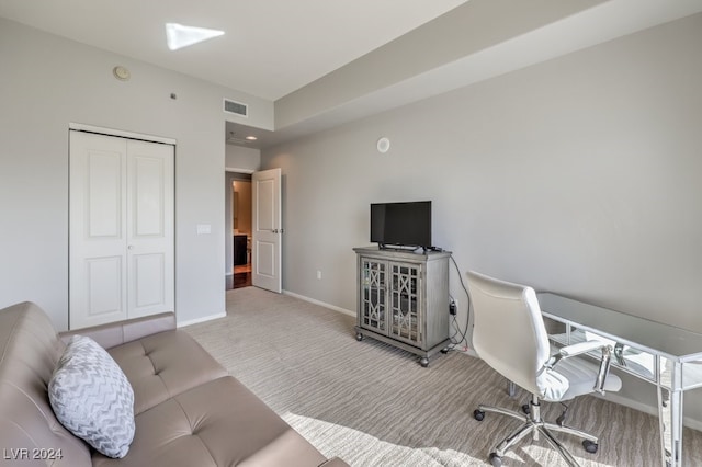 office area featuring carpet floors, baseboards, and visible vents