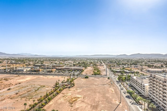 birds eye view of property featuring a mountain view