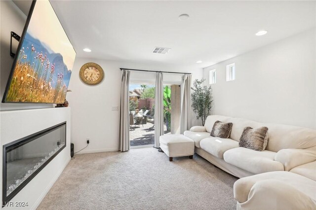 living room featuring light carpet