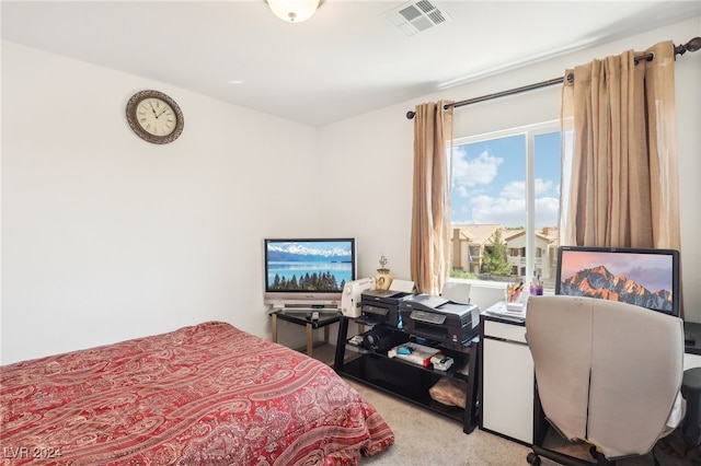 carpeted bedroom featuring multiple windows