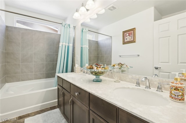 bathroom with vanity and shower / bath combo with shower curtain