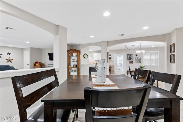 dining space featuring a notable chandelier