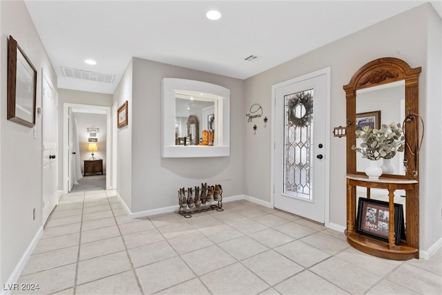 entryway featuring light tile patterned floors