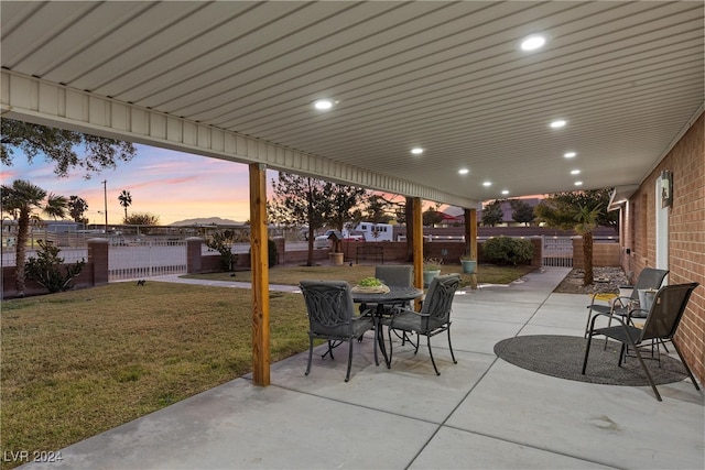 patio terrace at dusk with a lawn