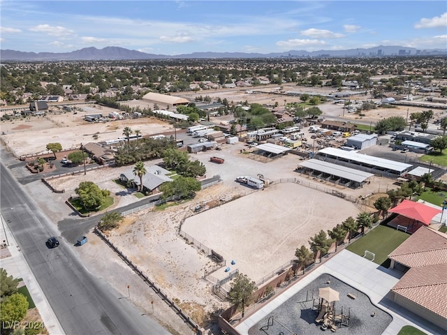 birds eye view of property featuring a mountain view