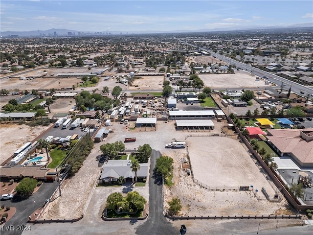 birds eye view of property featuring a mountain view