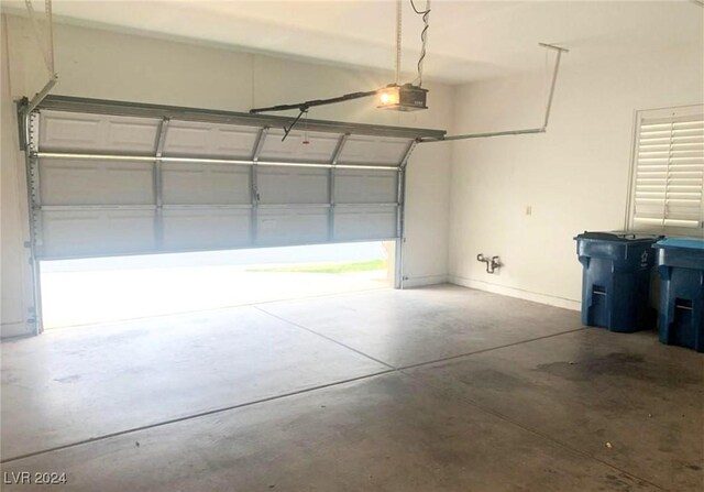 garage featuring baseboards and a garage door opener